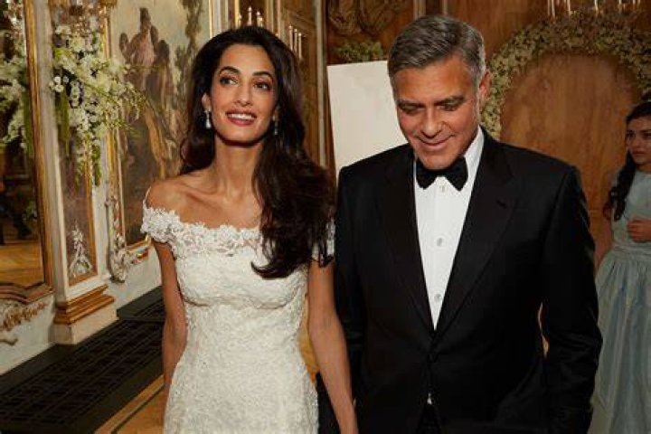 Amal vs Clooney who married up?
