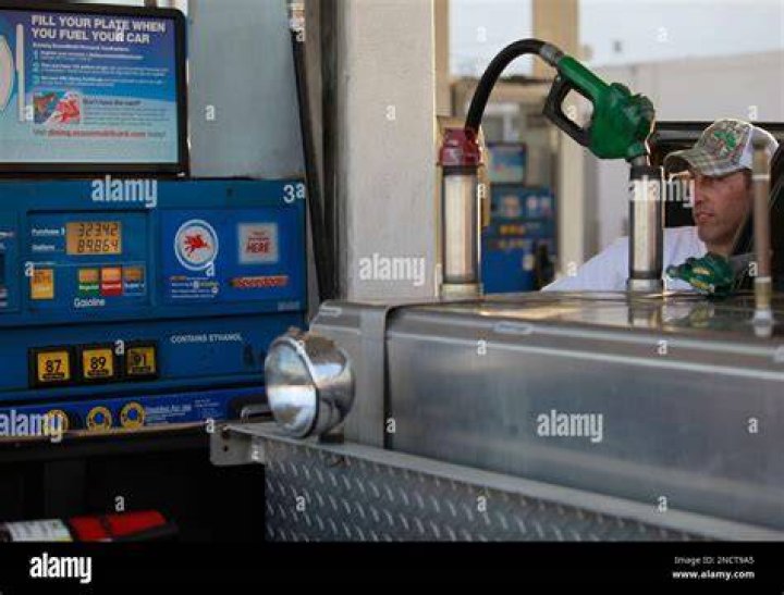 Domingo Benavides, a film production fueler fills his truck's gasoline