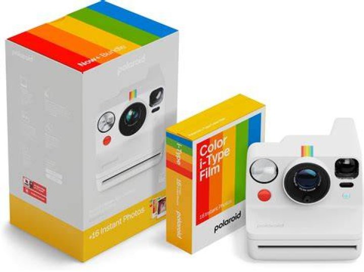 Set Of Instant Photos On Table by Guille Faingold